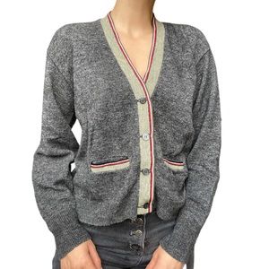 Gray knit cardigan with pockets and striped trim